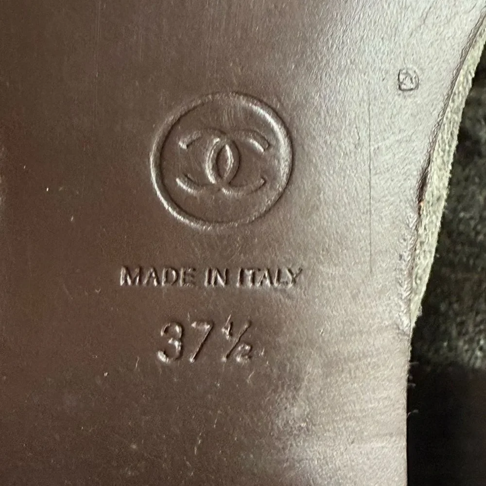 Chanel Women’s Gray Distressed Suede Leather Ankle Boots with CC Logo Buttons.